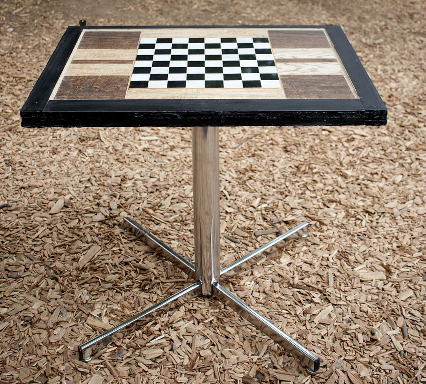 Completed handcrafted tile table with checkerboard design. Design by Mark Funk. Photo by Mary Anne Funk